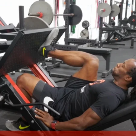 An athlete performing a single-leg leg press.